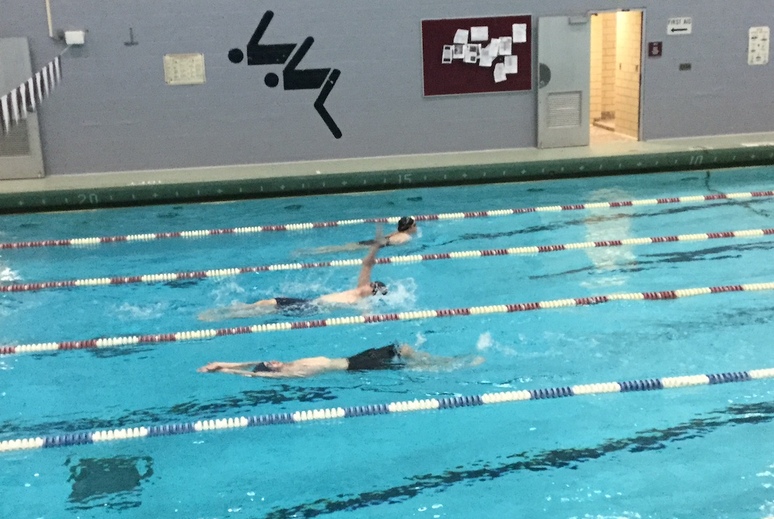 3 students swimming