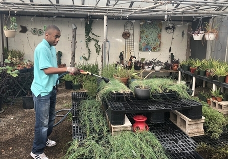Student Watering plants
